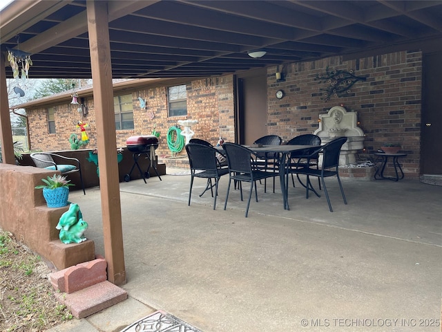 view of patio featuring outdoor dining space