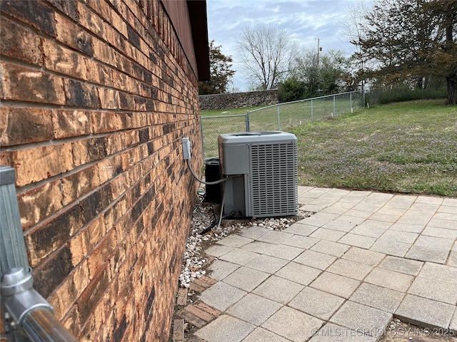 view of patio / terrace featuring fence private yard and central AC unit