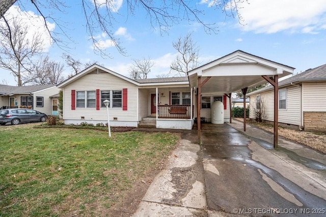 view of front of home featuring an attached carport, covered porch, driveway, crawl space, and a front yard