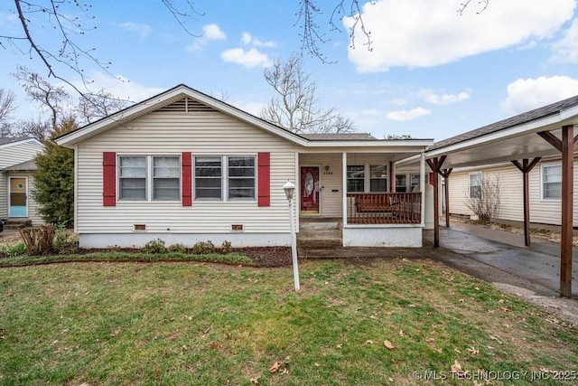 ranch-style home featuring a porch, crawl space, and a front yard