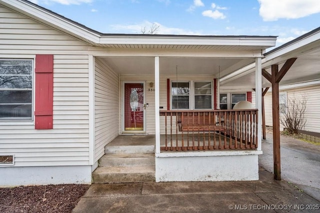 entrance to property with a porch