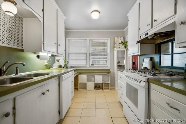 kitchen with white appliances, crown molding, under cabinet range hood, a sink, and light tile patterned flooring