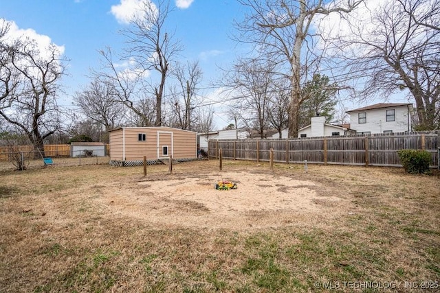 view of yard with a fenced backyard and an outdoor structure