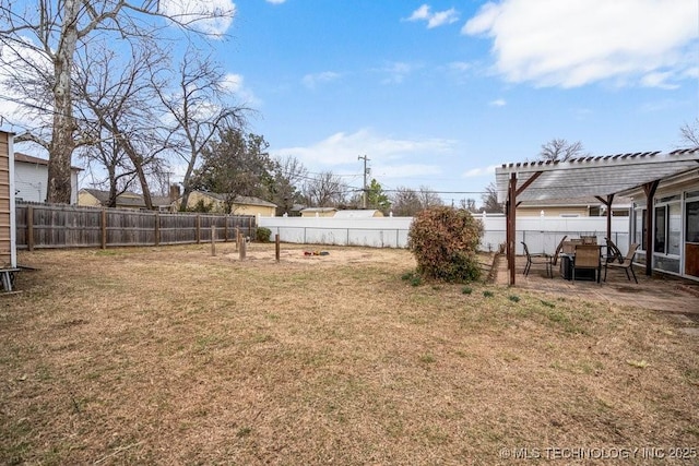 view of yard featuring a fenced backyard, a patio, and a pergola