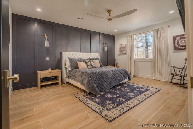 bedroom featuring a ceiling fan, recessed lighting, visible vents, and light wood-style floors