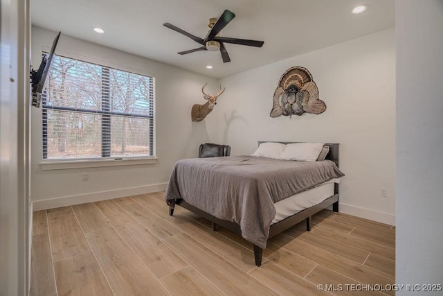 bedroom featuring recessed lighting, light wood-type flooring, a ceiling fan, and baseboards