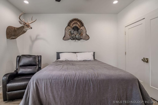 bedroom featuring recessed lighting and wood finished floors