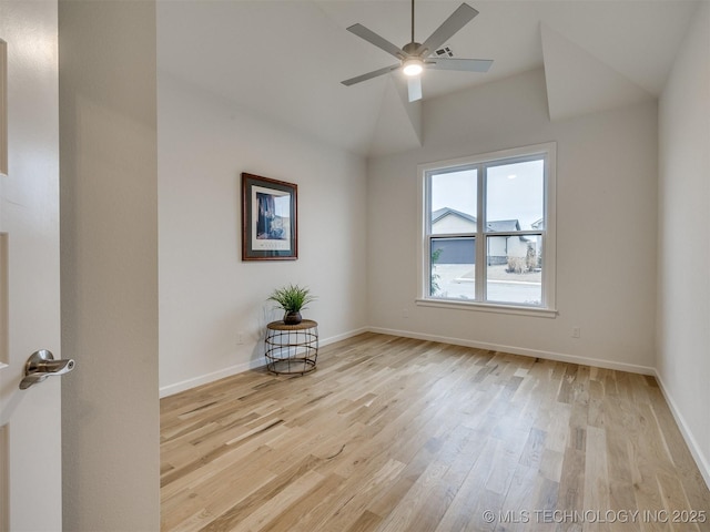 unfurnished room featuring vaulted ceiling, a ceiling fan, light wood-style flooring, and baseboards