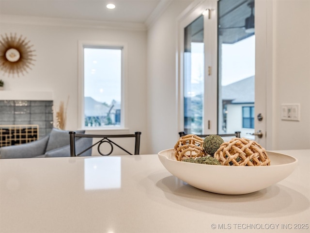 interior space featuring recessed lighting, a wealth of natural light, and crown molding