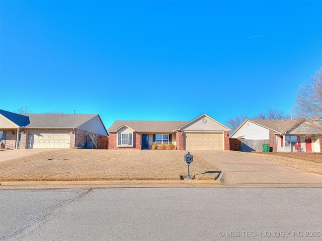 view of front of home featuring a garage, concrete driveway, brick siding, and fence