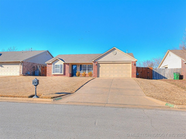 ranch-style home featuring an attached garage, brick siding, fence, driveway, and a gate