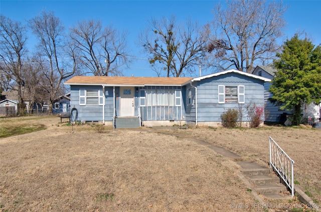 single story home with crawl space, fence, and a front yard