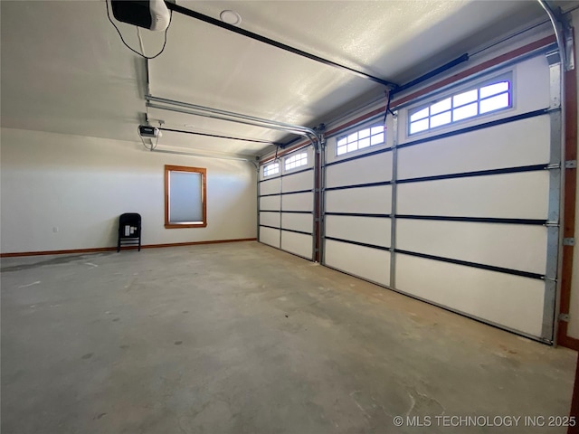 garage featuring baseboards and a garage door opener