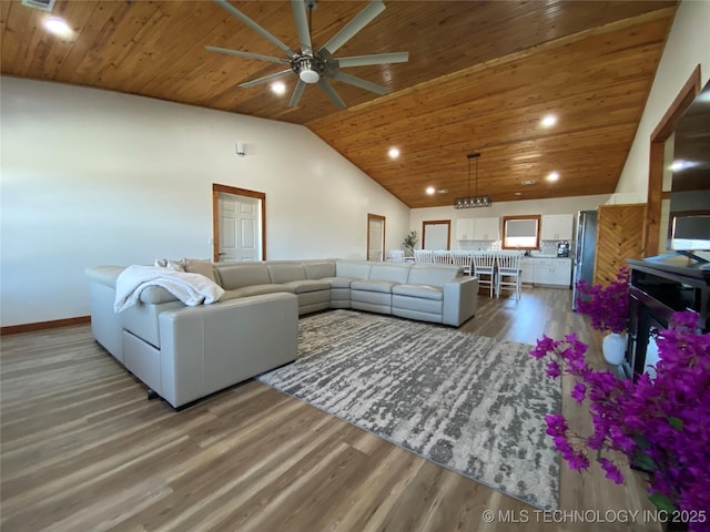 living area featuring wooden ceiling, high vaulted ceiling, wood finished floors, and recessed lighting