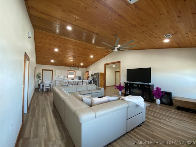 living room featuring recessed lighting, visible vents, a ceiling fan, wood ceiling, and wood finished floors