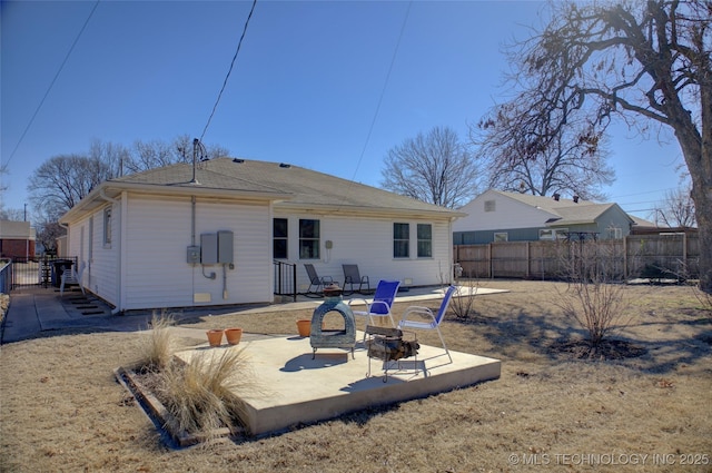 back of house featuring a patio area and fence