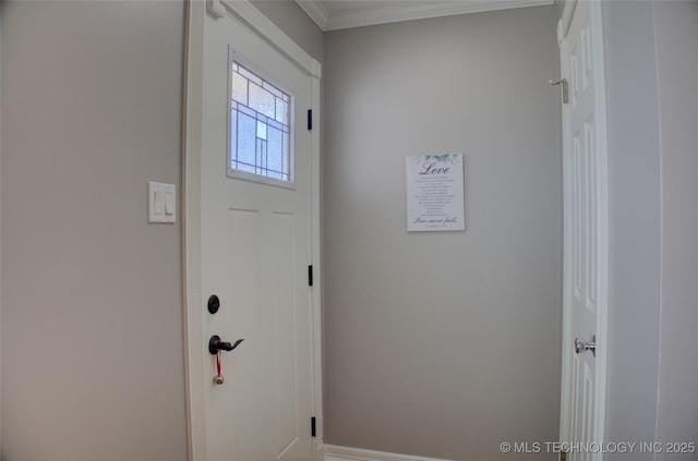 entryway featuring crown molding