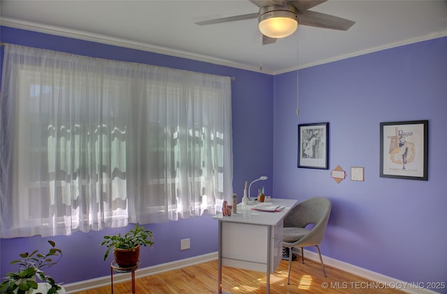 home office with a ceiling fan, ornamental molding, baseboards, and wood finished floors