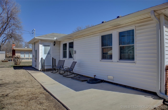 back of house featuring a patio area and fence