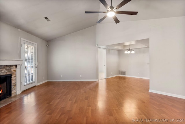 unfurnished living room with light wood-style floors, baseboards, a fireplace, and visible vents