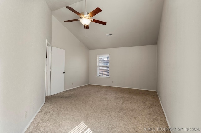 carpeted spare room with a ceiling fan, visible vents, high vaulted ceiling, and baseboards