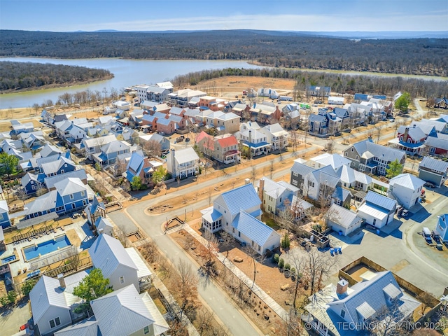 aerial view featuring a residential view and a water view