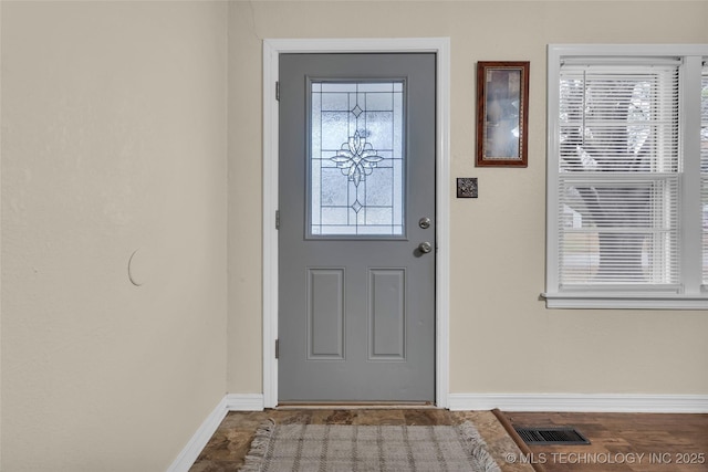 property entrance with visible vents