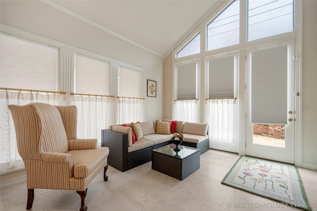 living room featuring vaulted ceiling and ornamental molding