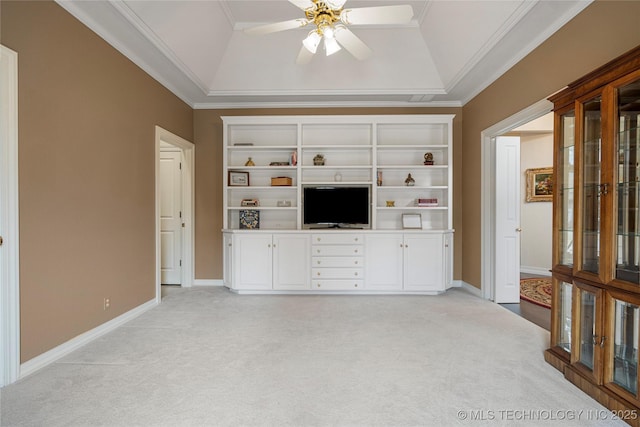 unfurnished living room with crown molding, ceiling fan, baseboards, lofted ceiling, and light carpet