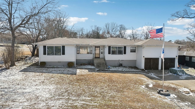 single story home featuring crawl space, driveway, and an attached garage