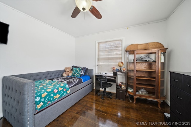 bedroom featuring hardwood / wood-style flooring and a ceiling fan