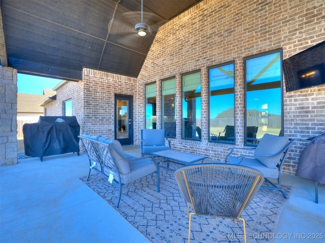 view of patio / terrace featuring ceiling fan and grilling area