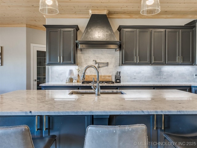 kitchen with premium range hood, wooden ceiling, backsplash, and light stone countertops