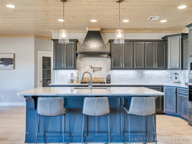 kitchen with visible vents, wood ceiling, custom range hood, light stone countertops, and light wood-style floors