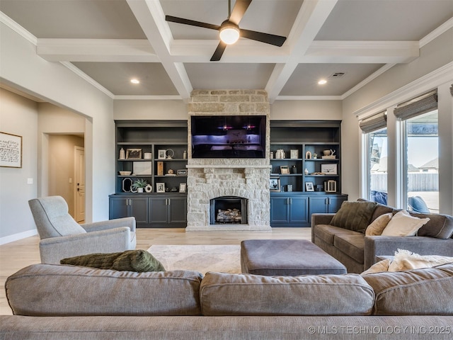 living area with light wood-style flooring, a fireplace, coffered ceiling, and beam ceiling