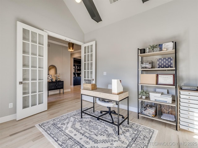 office space featuring baseboards, wood finished floors, and french doors