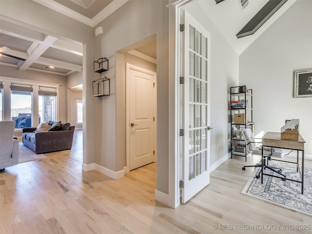 office area featuring ornamental molding, coffered ceiling, baseboards, and wood finished floors