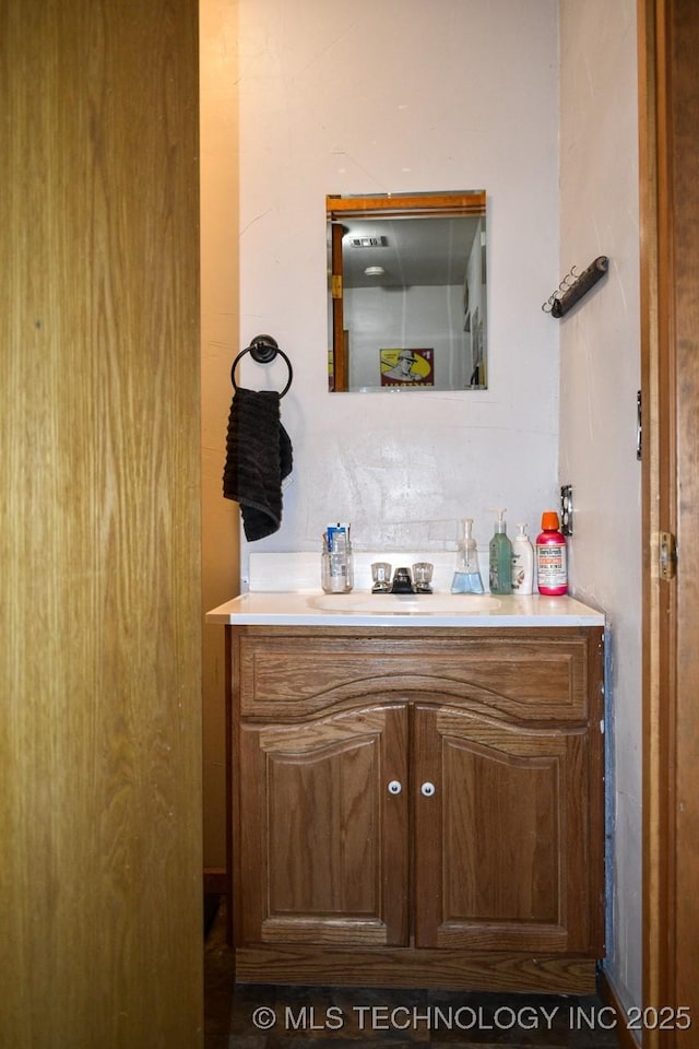 bathroom with decorative backsplash and vanity