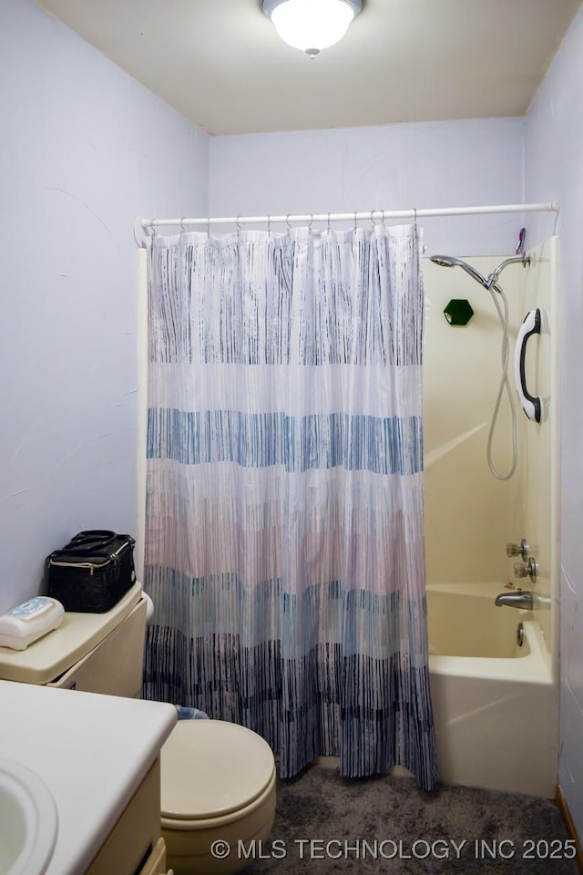 bathroom featuring vanity, toilet, and shower / bath combo with shower curtain