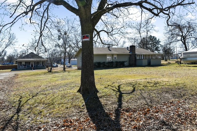 exterior space with a yard