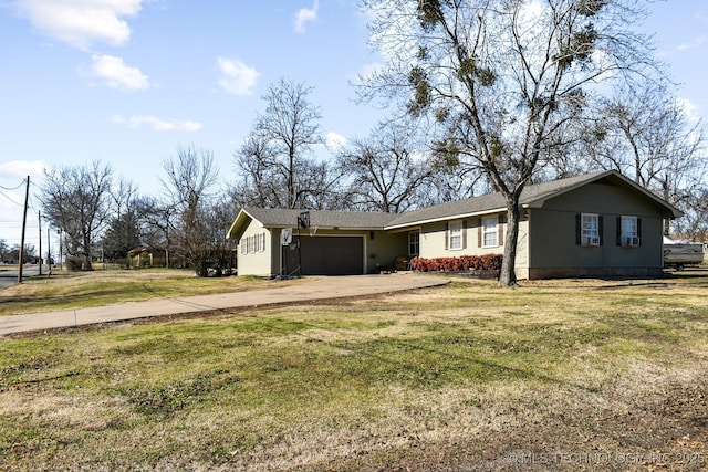 single story home featuring an attached garage, a front lawn, and concrete driveway