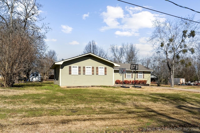 rear view of property with a lawn