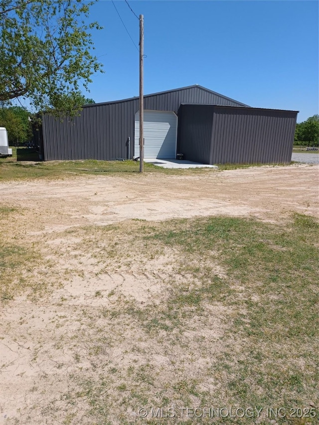 116965 S 4164, Eufaula, OK 74432 - view of yard with an outbuilding, a detached garage, and driveway