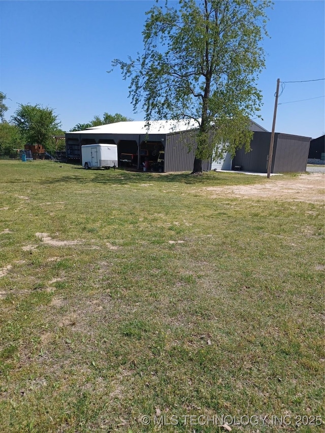 116965 S 4164, Eufaula, OK 74432 - view of yard featuring a garage, a pole building, and an outdoor structure