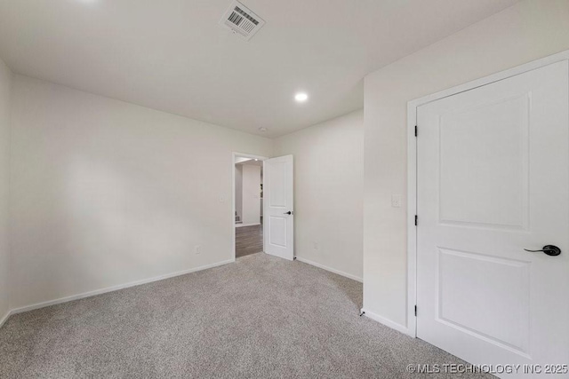 unfurnished bedroom featuring recessed lighting, carpet flooring, visible vents, and baseboards