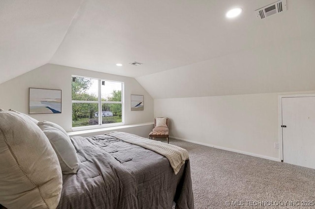 bedroom featuring carpet floors, baseboards, visible vents, and lofted ceiling