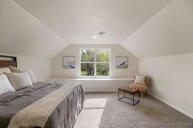 bedroom with carpet floors, visible vents, vaulted ceiling, and baseboards