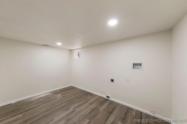 clothes washing area with hookup for a washing machine, laundry area, baseboards, dark wood finished floors, and electric dryer hookup