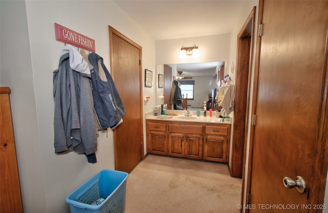 bathroom with ceiling fan and vanity