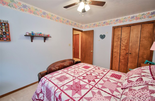 carpeted bedroom with a ceiling fan, baseboards, and a closet